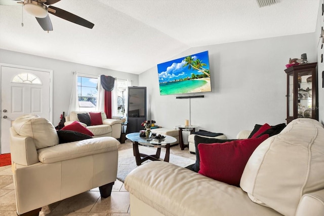 living room featuring light tile patterned floors, ceiling fan, and lofted ceiling