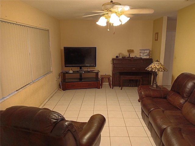 tiled living room featuring ceiling fan