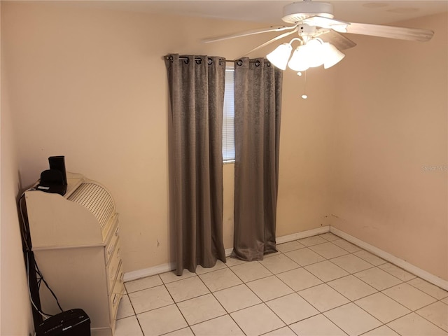 unfurnished bedroom with ceiling fan and light tile patterned flooring