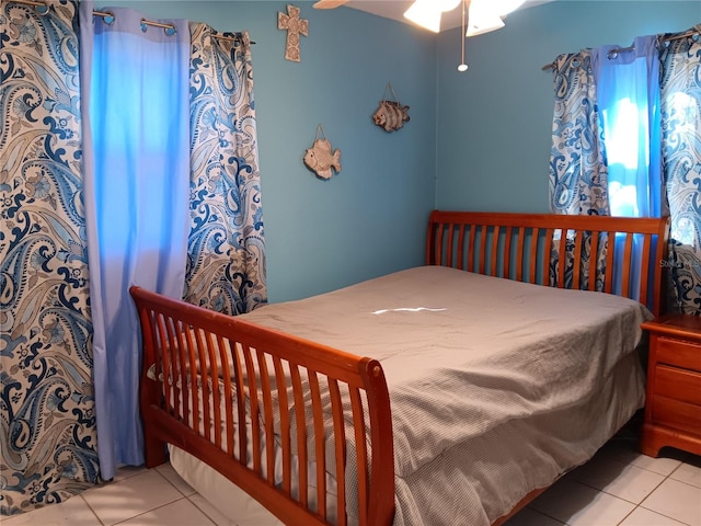 bedroom featuring ceiling fan and light tile patterned flooring