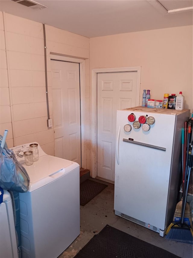 laundry room with washer / clothes dryer