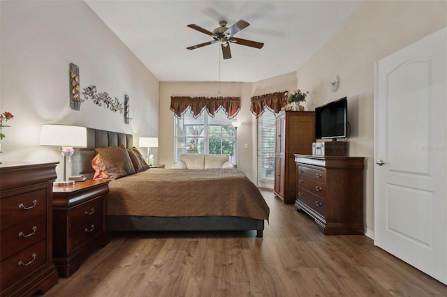 bedroom featuring dark wood-type flooring and ceiling fan