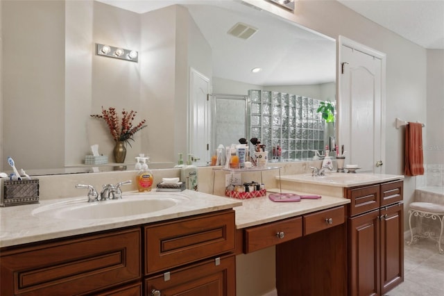 bathroom featuring vaulted ceiling, tile patterned flooring, walk in shower, and vanity