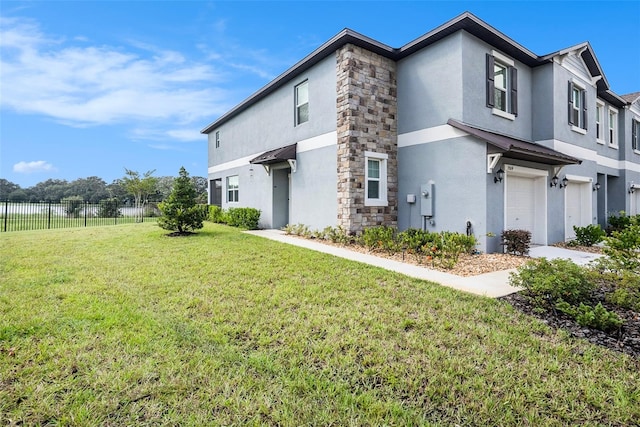 exterior space featuring a front yard and a garage