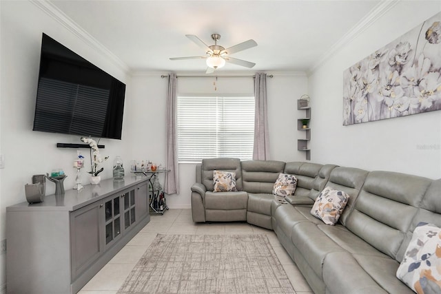 living room with ceiling fan, ornamental molding, and light tile patterned floors