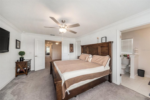 carpeted bedroom featuring crown molding, connected bathroom, and ceiling fan