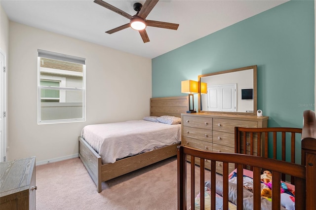 bedroom with ceiling fan and carpet floors