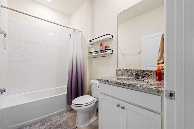 full bathroom featuring shower / bath combo, vanity, and toilet