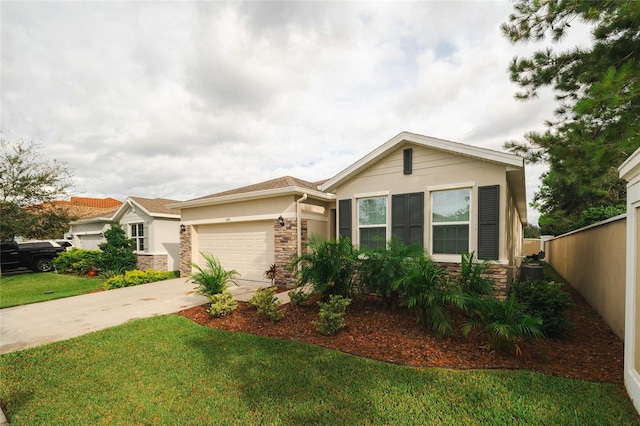 view of front of home with a front yard and a garage