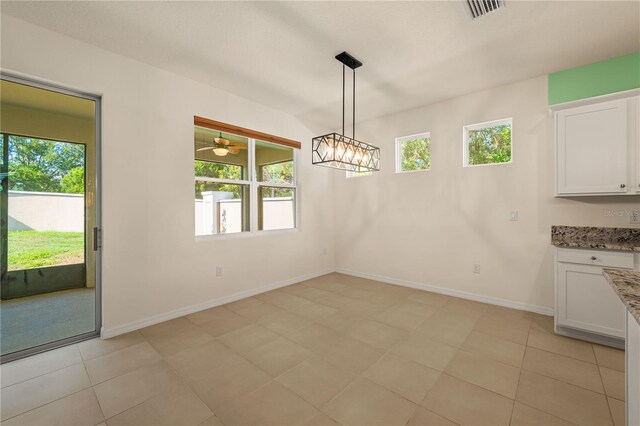 11892 Frost Aster Dr, Riverview, FL 33579 - unfurnished dining area with a ceiling fan, baseboards, and light tile patterned flooring