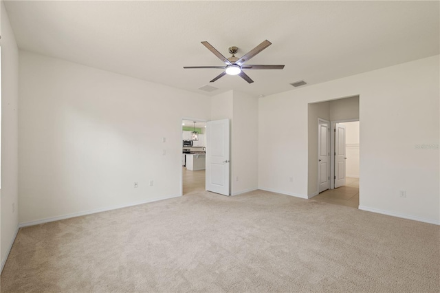 11892 Frost Aster Dr, Riverview, FL 33579 - unfurnished bedroom featuring light carpet, baseboards, and ceiling fan