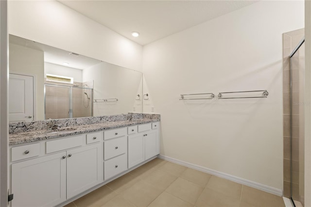 11892 Frost Aster Dr, Riverview, FL 33579 - bathroom featuring a shower stall, double vanity, and baseboards