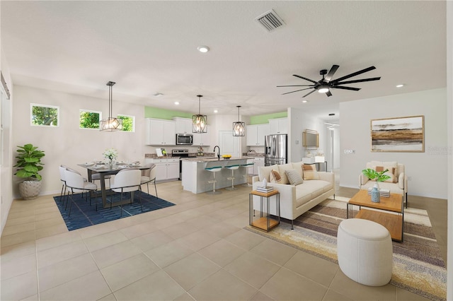 11892 Frost Aster Dr, Riverview, FL 33579 - living room featuring recessed lighting, a ceiling fan, light tile patterned flooring, and baseboards