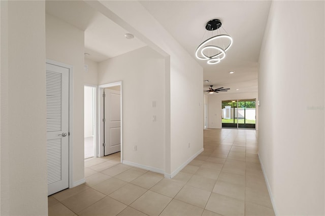 11892 Frost Aster Dr, Riverview, FL 33579 - hallway with light tile patterned floors and baseboards