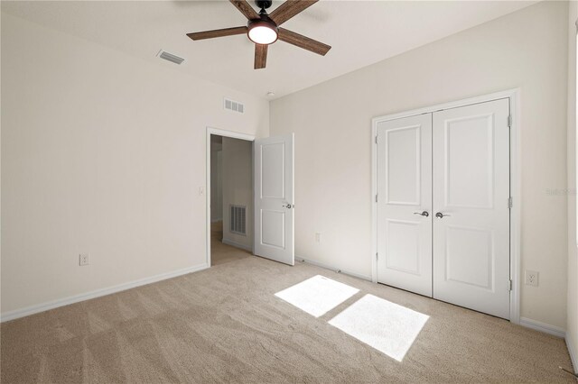 11892 Frost Aster Dr, Riverview, FL 33579 - unfurnished bedroom with light colored carpet, baseboards, a closet, and ceiling fan