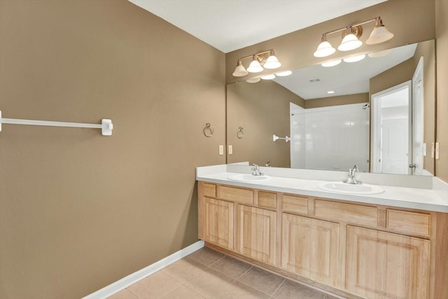 bathroom featuring a shower, tile patterned flooring, and vanity