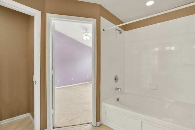 bathroom with tile patterned floors, ceiling fan, and  shower combination