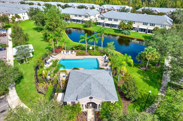 birds eye view of property with a water view