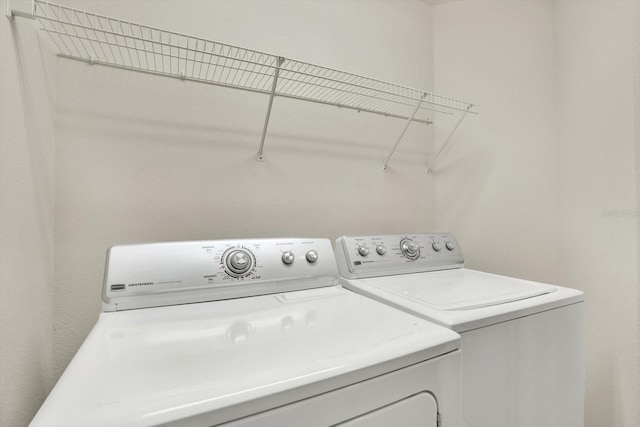 laundry area with washing machine and dryer