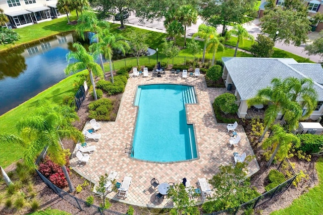 view of swimming pool featuring a water view