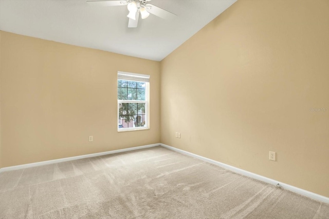 spare room with light carpet, ceiling fan, and lofted ceiling