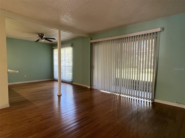 spare room featuring a textured ceiling, dark hardwood / wood-style floors, and ceiling fan