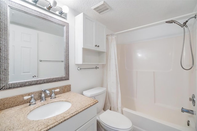 full bathroom featuring vanity, shower / bath combo, a textured ceiling, and toilet