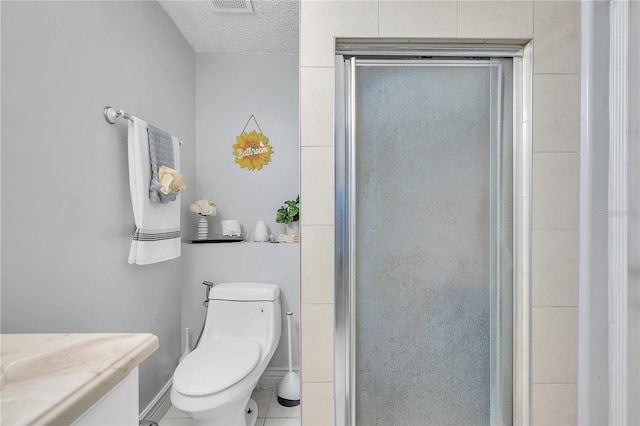 bathroom featuring tile patterned flooring, a textured ceiling, an enclosed shower, and toilet