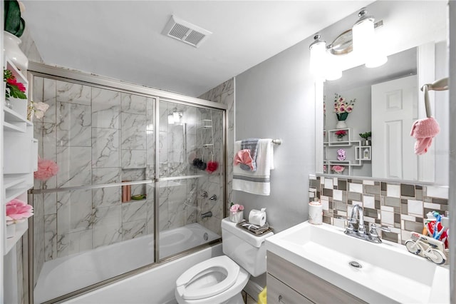 full bathroom with backsplash, bath / shower combo with glass door, vanity, and toilet