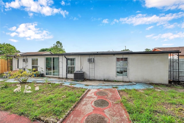 rear view of property with a patio and cooling unit