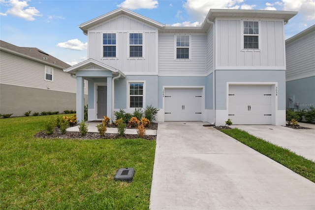 view of front of house with a garage and a front yard