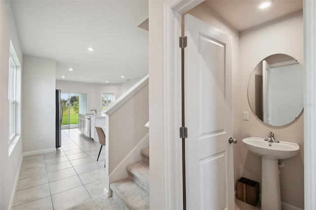 interior space with tile patterned flooring and sink