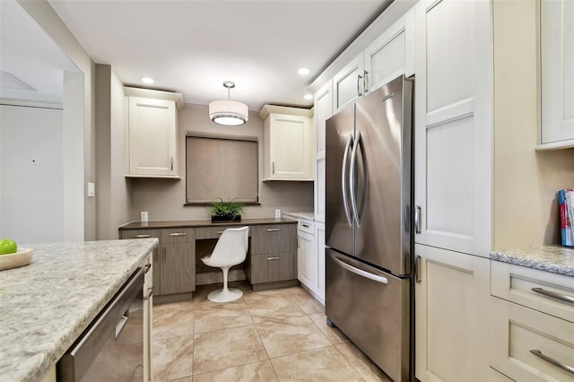 kitchen with stainless steel appliances, light stone countertops, light tile patterned floors, and white cabinetry