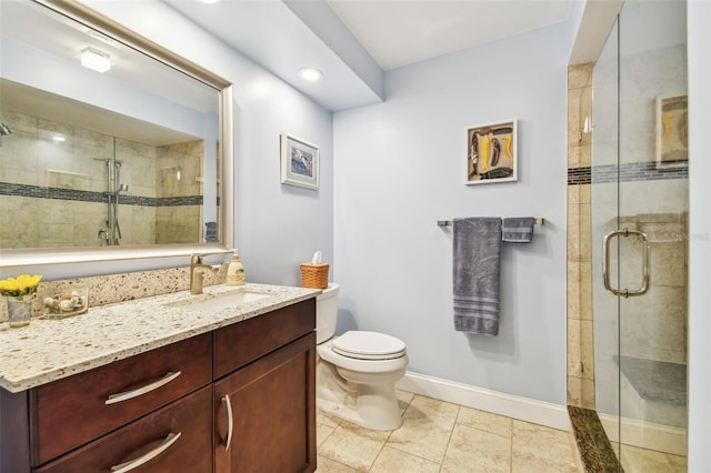 bathroom featuring toilet, tile patterned flooring, an enclosed shower, and vanity