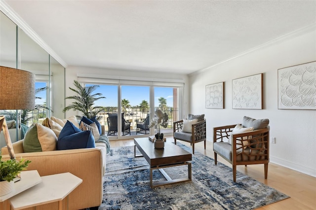 living room with hardwood / wood-style floors and crown molding