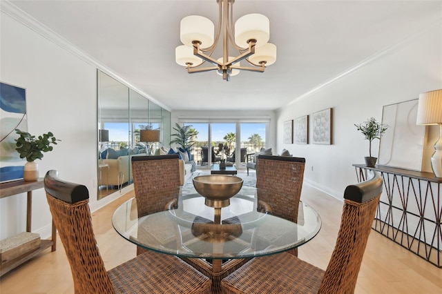 dining space with light wood-type flooring, crown molding, and a chandelier