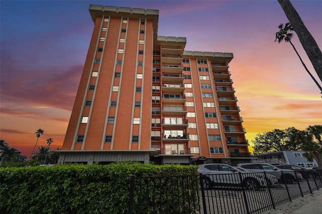 view of outdoor building at dusk