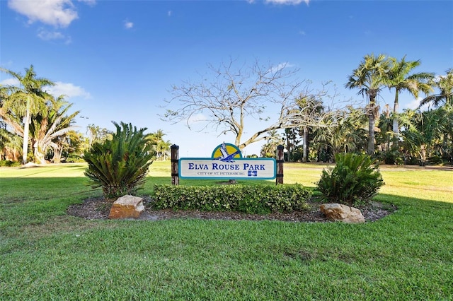 community / neighborhood sign with a lawn