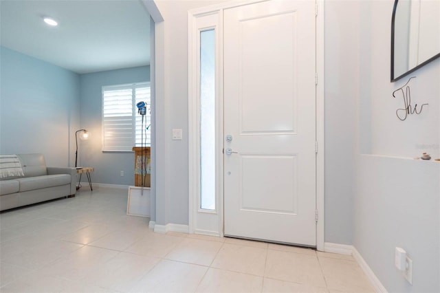 foyer entrance featuring light tile patterned flooring