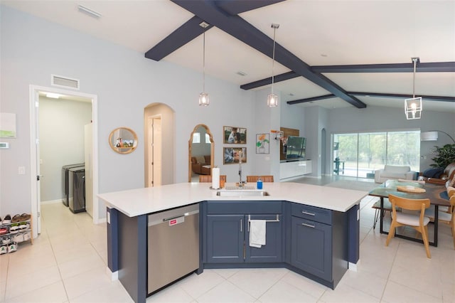 kitchen with an island with sink, stainless steel dishwasher, blue cabinetry, and sink