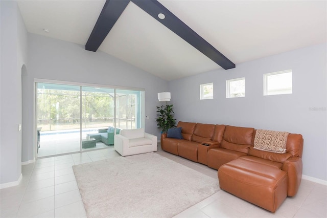 living room with lofted ceiling with beams and light tile patterned floors