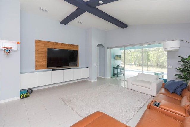 living room featuring light tile patterned flooring and beamed ceiling