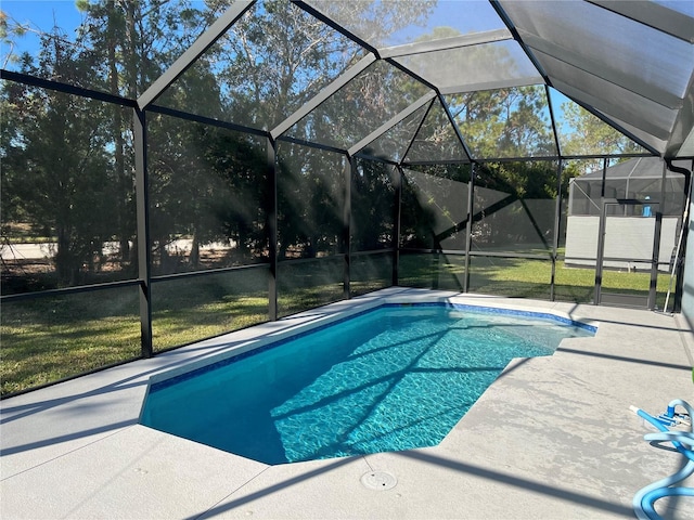 view of pool featuring a patio, a lanai, and a yard