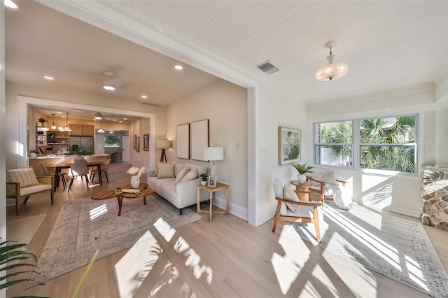 living room with light hardwood / wood-style flooring