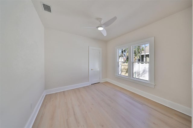 empty room with light hardwood / wood-style floors and ceiling fan