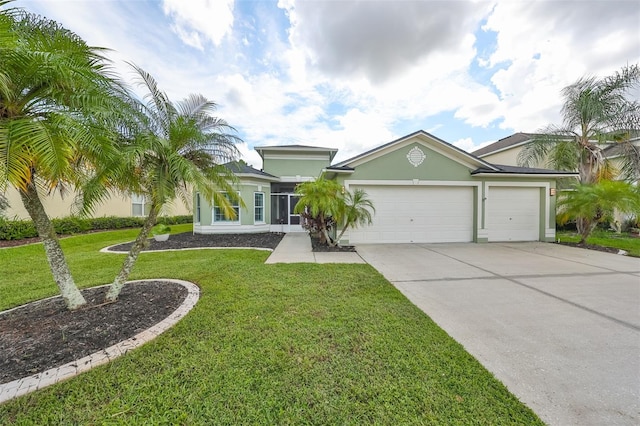 view of front of home with a garage and a front lawn