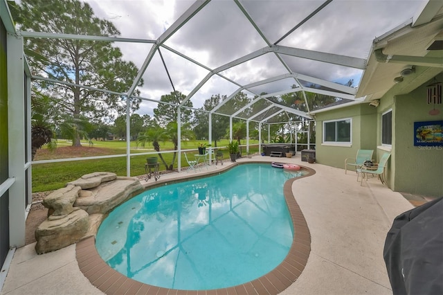 view of swimming pool with glass enclosure, a lawn, and a patio