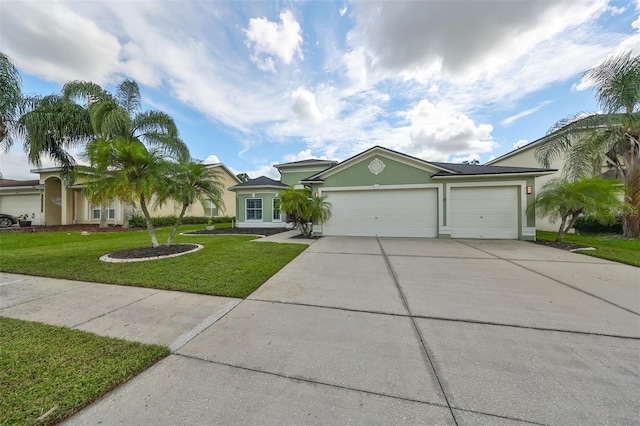 ranch-style home with a front yard and a garage