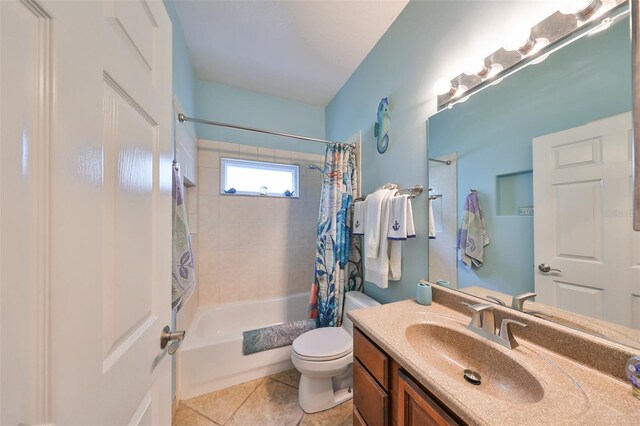 full bathroom featuring shower / bath combination with curtain, vanity, toilet, and tile patterned floors