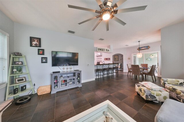 living room featuring ceiling fan